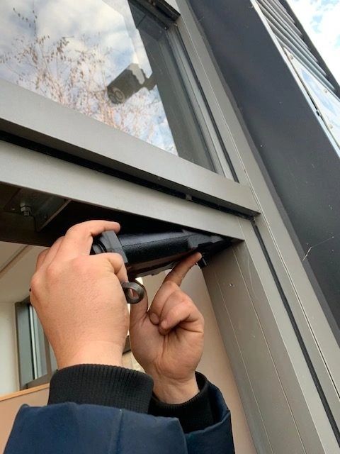 A commercial door being repaired by a CODORE engineer