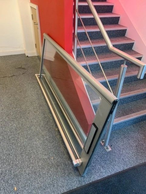 A commercial door being repaired on-site