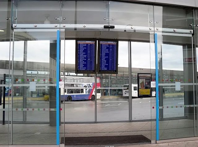 Automatic sliding glass entrance doors at a transport interchange