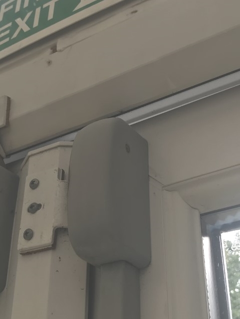 Panic bars fitted to a commercial fire escape door
