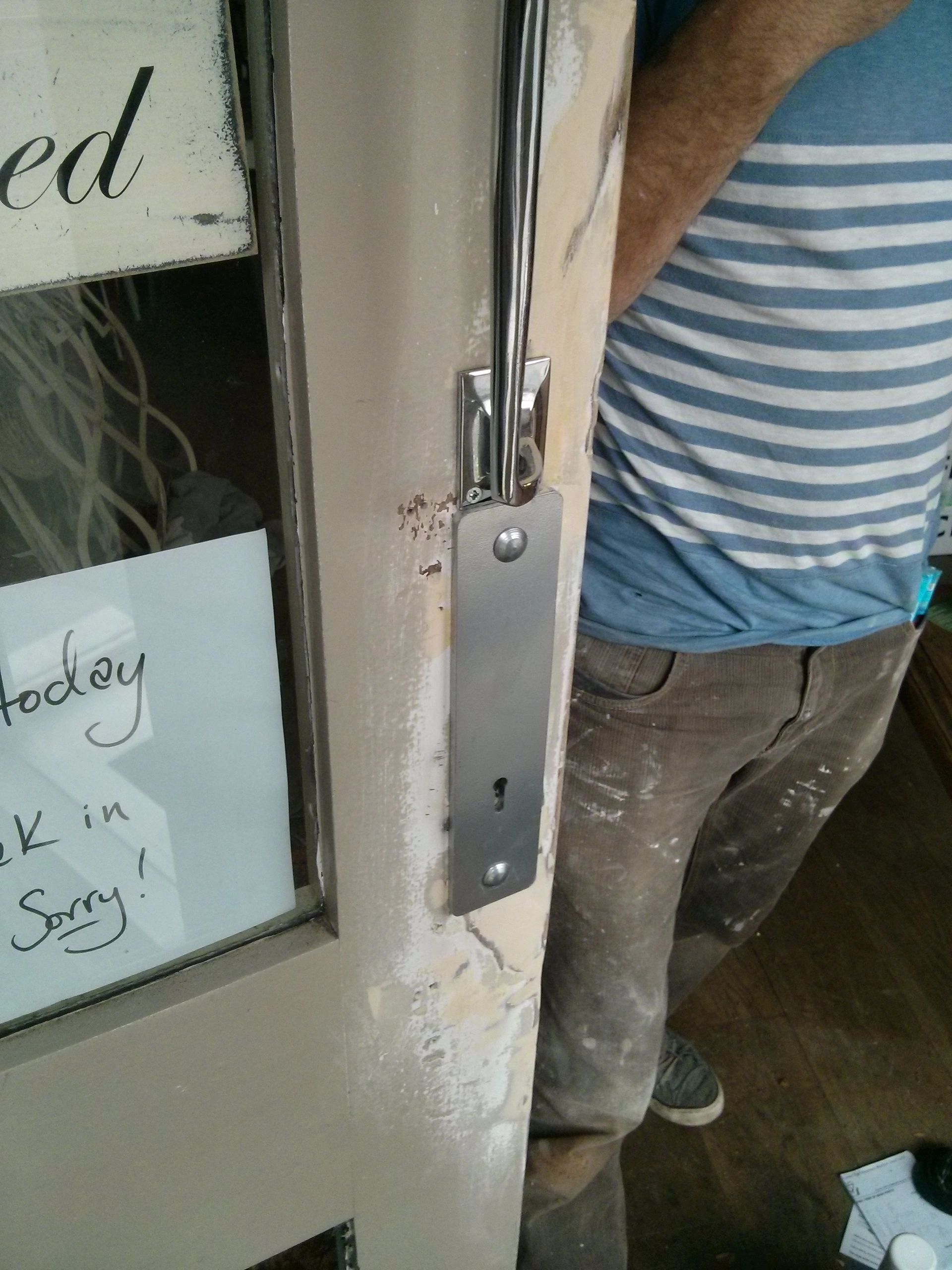 A shop door repaired with a new shop door lock